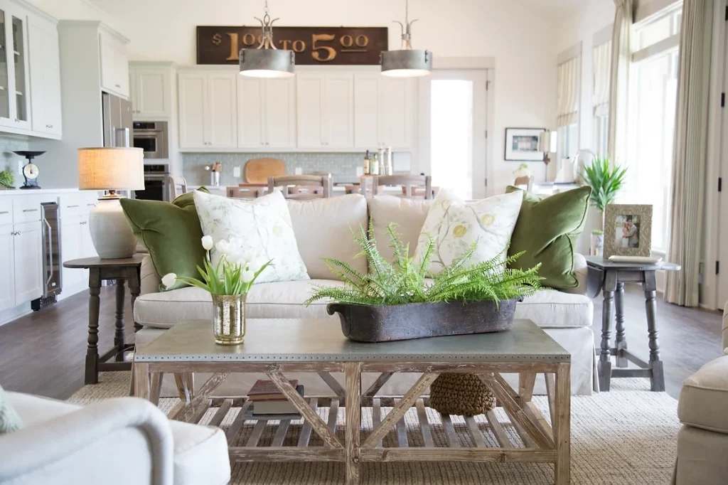 Bright living room with green accent pillows.